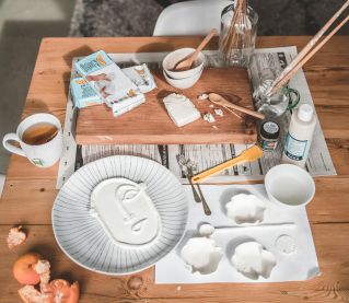 White Ceramic Mug on Brown Wooden Table